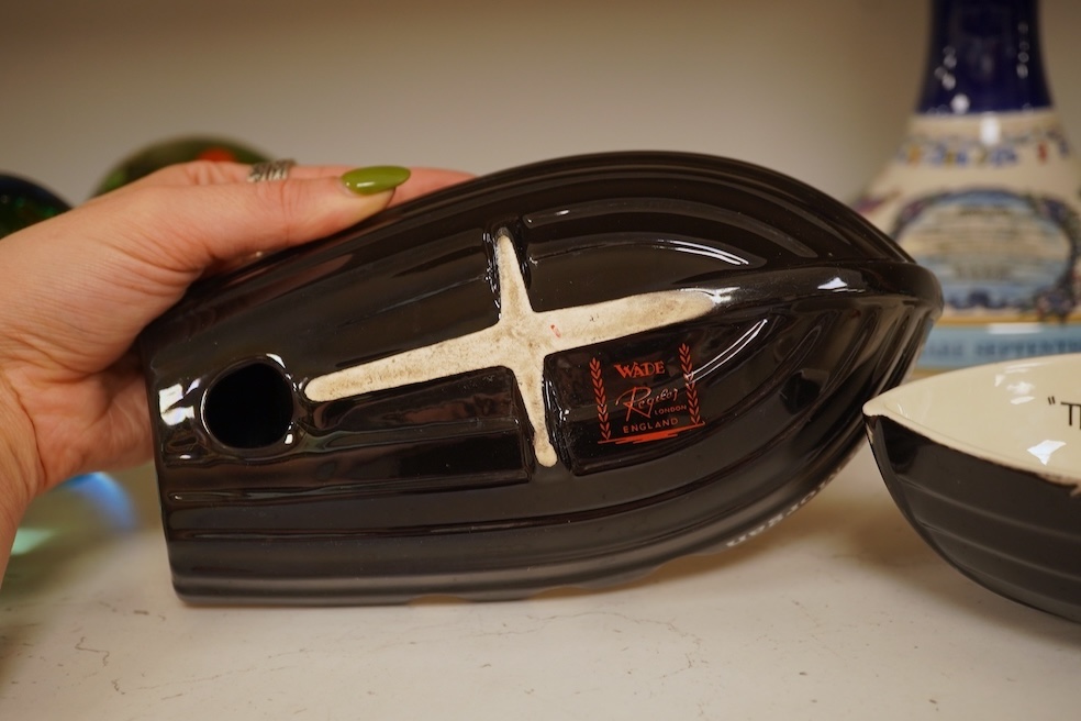 Wade 'Purser's Navy Rum Decanter' and two Captain Morgan rum boat ashtrays, decanter 24cm high